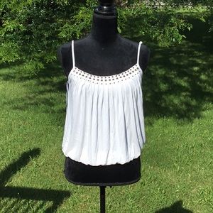 Guc cream color tank with adjustable straps.